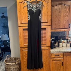Betsy & Adam Black Backless Gown with Silver Accents
